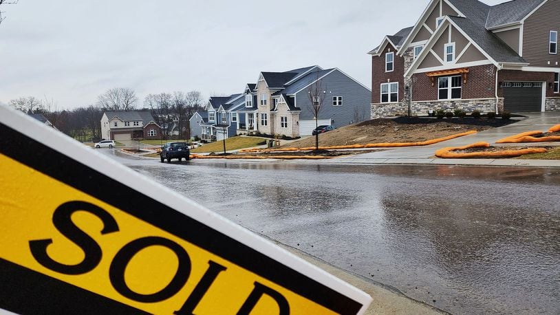 Home prices in Butler and Warren counties remained steady despite there being significantly fewer listings and significantly fewer sales at the end of 2022. Seen here are homes in a West Chester neighborhood. NICK GRAHAM/STAFF