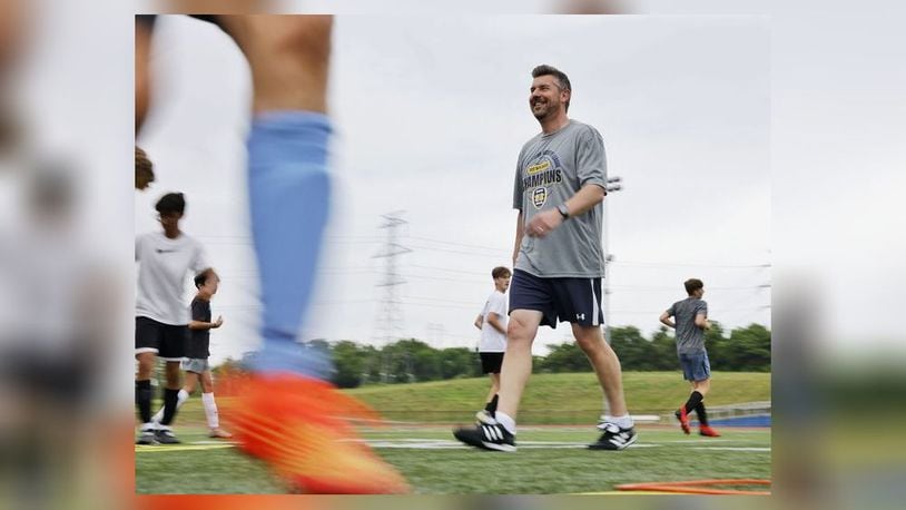 Butler County Common Pleas Court Judge Michael Oster Jr. spends a good amount of his time away from court on the soccer field coaching Monroe High School boys varsity soccer team. NICK GRAHAM/STAFF