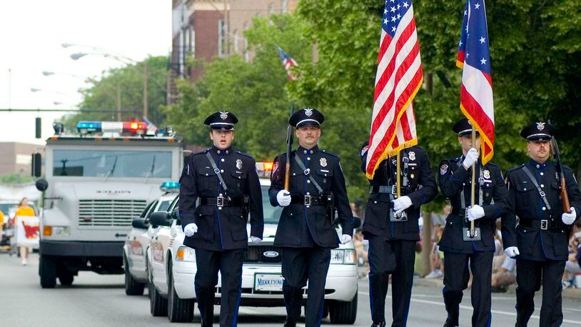 The Middletown Police Department Color Guard travels down Verity Parkway during a past Memorial Day parade. This year's parade, set to step off at 10 a.m. Monday, will travel from Smith Park to Woodside Cemetery where a memorial service will be held. FILE PHOTO  

NICHOLAS S. GRAHAM