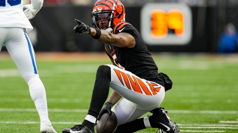 Cincinnati Bengals wide receiver Tee Higgins (5) signals for a first down after a catch against the Indianapolis Colts in the second half of an NFL football game in Cincinnati, Sunday, Dec. 10, 2023. (AP Photo/Carolyn Kaster)