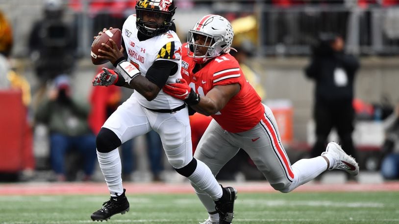 COLUMBUS, OH - NOVEMBER 9:  Tyreke Smith #11 of the Ohio State Buckeyes chases down quarterback Tyrrell Pigrome #3 of the Maryland Terrapins for a sack in the second quarter at Ohio Stadium on November 9, 2019 in Columbus, Ohio.  (Photo by Jamie Sabau/Getty Images)