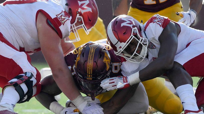 Esezi Otomewo #9 of the Minnesota Golden Gophers recovers a fumble against Matt Skibinski #77 and Dominique Robinson #11 of the Miami RedHawks during the third quarter of the game on September 15, 2018 at TCF Bank Stadium in Minneapolis, Minnesota. (Photo by Hannah Foslien/Getty Images)