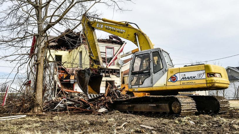 S/R Demolition of Fairfield recently tore down the house at 1007 Maple Ave., in Hamilton, one of about 420 that have been demolished in the city since early 2013. NICK GRAHAM / STAFF