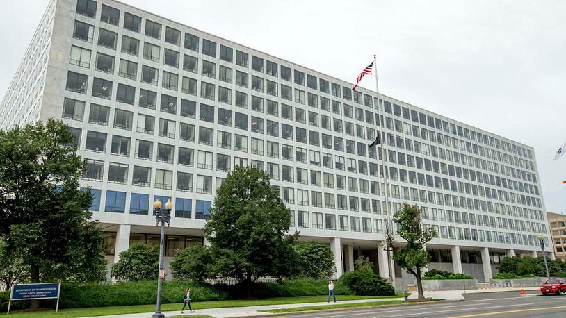 FILE - This file photo shows the Department of Transportation Federal Aviation Administration building in June 2015 in Washington. For more than six decades, the Federal Aviation Administration has relied on employees of airplane manufacturers to do government-required safety inspections as planes are being designed or assembled. But critics say the system, dubbed the "Designee Program," is too cozy as company employees do work for an agency charged with keeping the skies safe while being paid by an industry that the FAA is regulating.