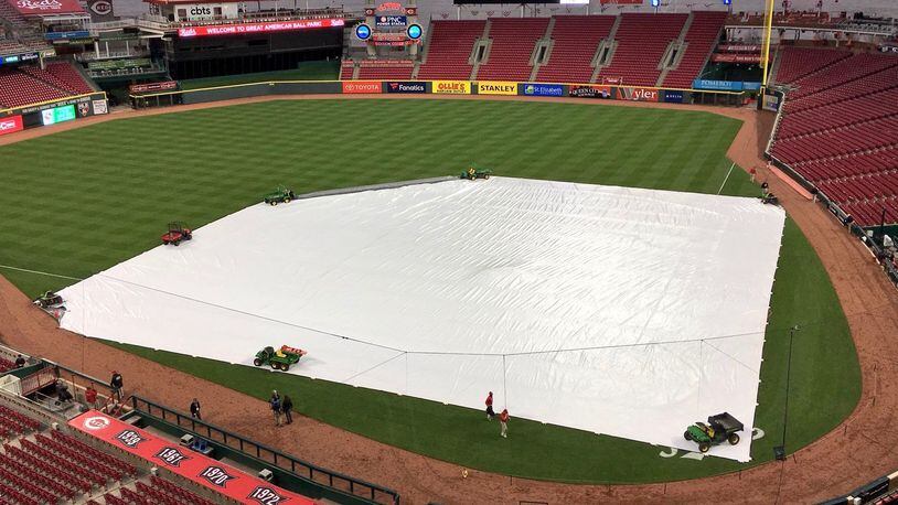 A tarp covers the field at Great American Ball Park on Tuesday, April 3, 2018, in Cincinnati.