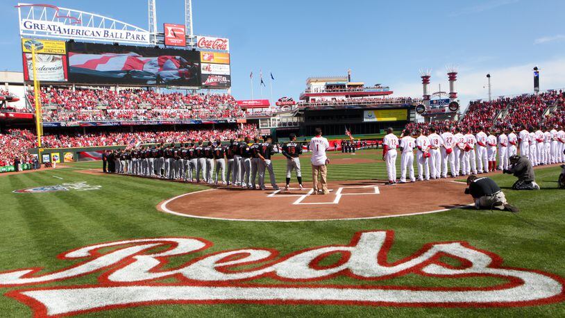 The Cincinnati Reds and the Miami Marlins are introduced prior to their Opening Day game at Great American Ballpark, Thursday, April 5, 2012. Staff photo by Greg Lynch
