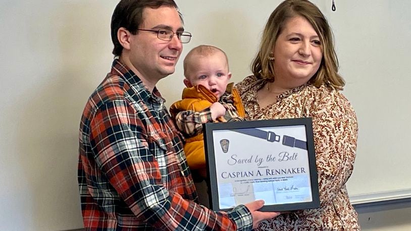Micheala and Donovan Rennaker, and their son Caspian, survived what could have been a deadly car crash in February thanks to the use of safety belts and a properly secured infant car seat. The family was honored Saturday with the Ohio Department of Public Safety's "Saved by the Belt" award.