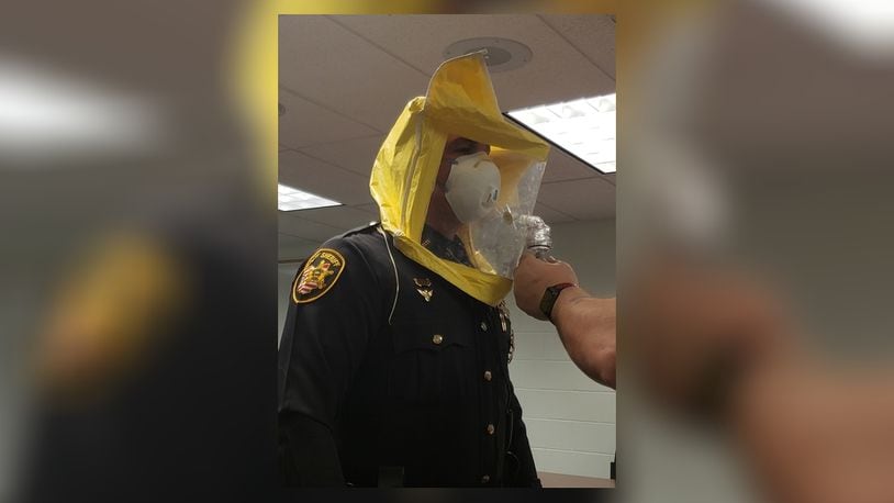 A deputy is fit tested with a safety mask Butler County Sheriff’s deputies will be wearing if responding to a person in quarantine who need assistance. BUTLER COUNTY SHERIFF’S OFFICE