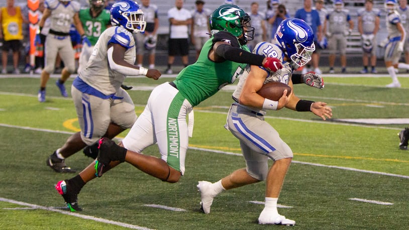 Northmont defensive end Cedric Works sacks Miamisburg's Preston Barr in the first half Thursday night. Jeff Gilbert/CONTRIBUTED