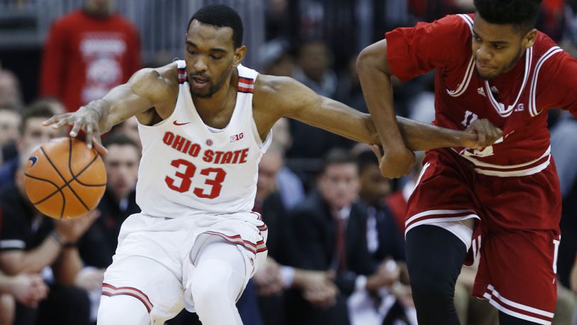 Ohio State forward Keita Bates-Diop, left, chases a loose ball against Indiana forward Juwan Morgan during the first half of an NCAA college basketball game in Columbus, Ohio, Tuesday, Jan. 30, 2018. (AP Photo/Paul Vernon)