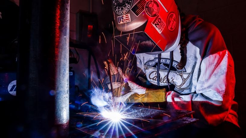 Riley Russell, 16, works on a project in the welding program at Butler Tech Wednesday, Oct. 18, 2023 in Fairfield Township. NICK GRAHAM/STAFF