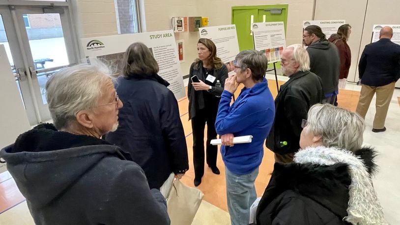 Scores of residents from Hamilton and neighboring communities attended the north Hamilton Crossing open house at Fairgrove Elementary in Hamilton Monday evening, Jan. 23, 2023. Attendees viewed the several alternative options for routes to cross the Great Miami River to create a new east-west access for traffic. In addition to informational, posters, officials from the city, the Ohio Department of Transportation, and the project management firm Stantec were available to answer questions and address comments. MICHAEL D. PITMAN/STAFF