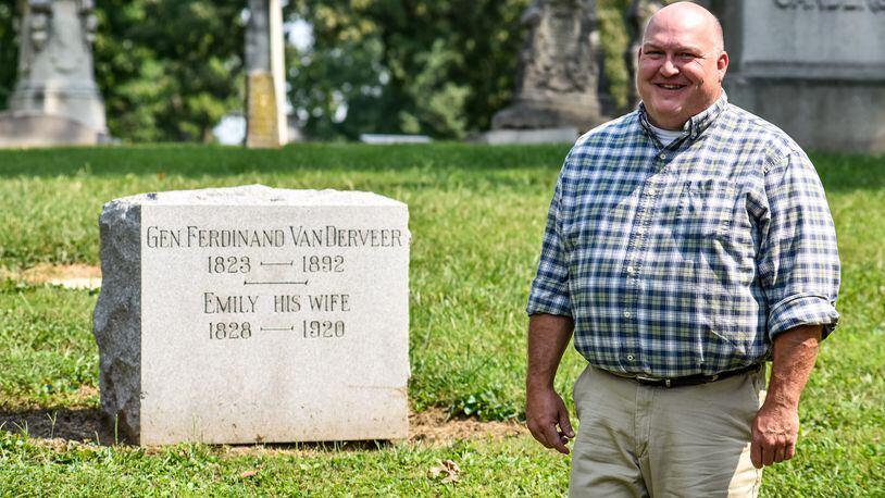 FILE PHOTO: Brian Smith, of the Butler County Historical Society, stands beside a grave marker for Gen. Ferdinand Van Derveer at Greenwood Cemetery in Hamilton. The Butler County Historical Society is in the process of restoring an American flag brought back by Gen. Van Derveer after flying with the 35th Ohio Infantry Regiment at the Battle of Missionary Ridge during the American Civil War. NICK GRAHAM / STAFF