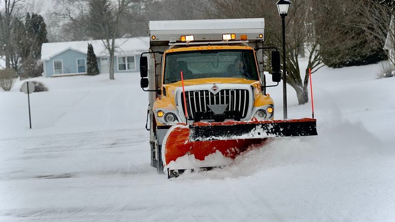City of Springfield snow plows were out early Friday morning February 4, 2022 clearing roads like this one on Andover Drive.