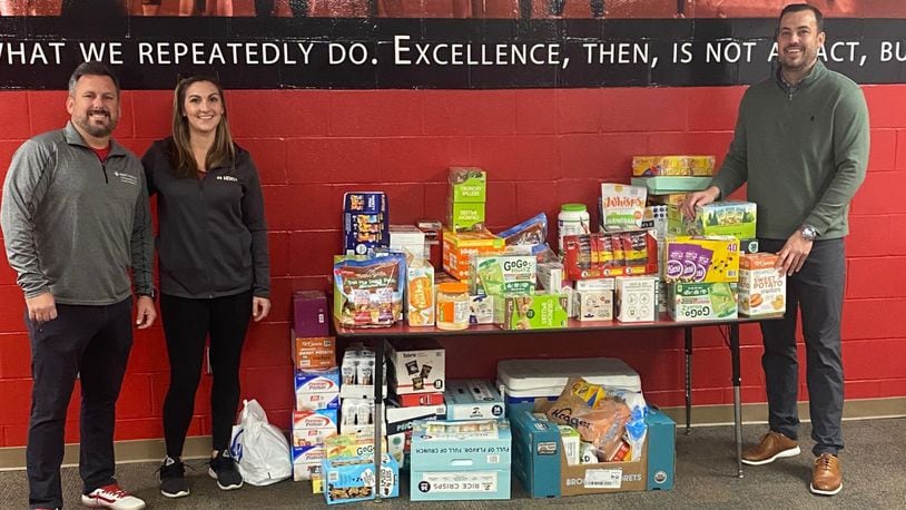 After hearing some Fairfield High School athletes were wolfing down unhealthy snacks before practicing, school officials scrambled together to create a first-of-its-kind organic and healthy snack pantry for team members. One of the district's new school athlete pantries' recent donation is pictured with Donation from HOIST Hydration: Mercy Health Athletic Trainer Brad Fraser, Rachel Trotta from HOIST Hydration, and Aaron Blankenship District Athletic Director. (Provided Photo\Journal-News)