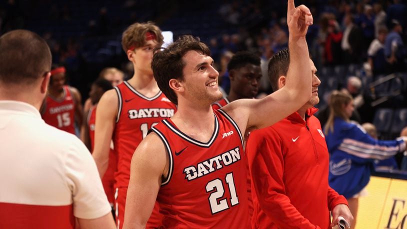 Dayton's Brady Uhl reacts after seeing his friends, who had painted his last name on their chests, in the stands after a victory against Saint Louis on Tuesday, March 5, 2024, at Chaifetz Arena in St. Louis, Mo. David Jablonski/Staff