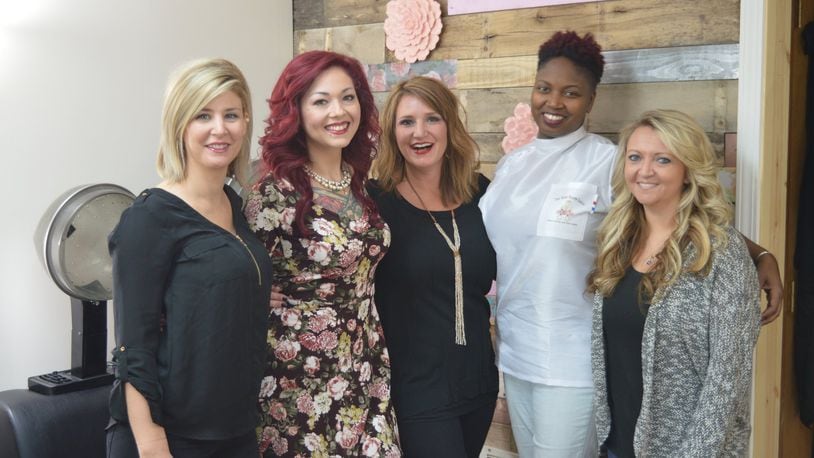 The Rose Room Salon opened at 318 S. College Ave. as a booth rental business where each stylist operates her own business with the salon owned by Christa Schram. Pictured are, from left, Gini Combs, Schram, Paige Sewell Hackney, barber Juiquetta Harmon and Julie Combs. Absent when the picture was taken were Brittany Marcum and Alexis Neff. CONTRIBUTED/BOB RATTERMAN