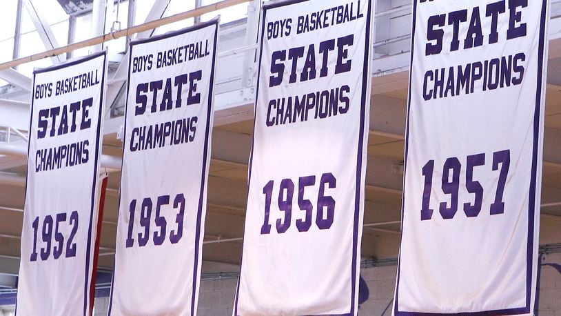 Banners for four of the five state championships Paul Walker led his Middletown High School teams to are pictured in Wade E. Miller Gymnasium. Walker finished his 40-year career with a 695-169 record and still ranks third all-time in the state of Ohio. He was 562-136 in 30 years with the Middies. Walker led the Middies to five state basketball championships: 1947, ‘52, ‘53, ‘56 and ‘57. NICK GRAHAM/STAFF