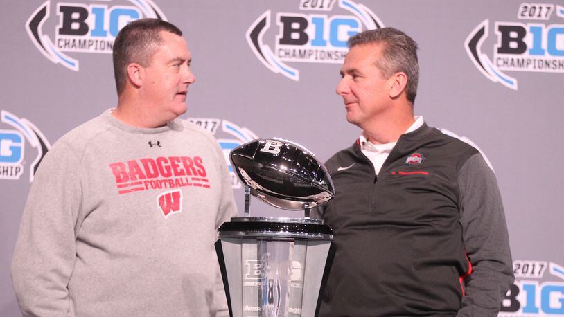 Wisconsin coach Paul Chryst and Ohio State's Urban Meyer talk a day before the 2017 Big Ten Championship game.
