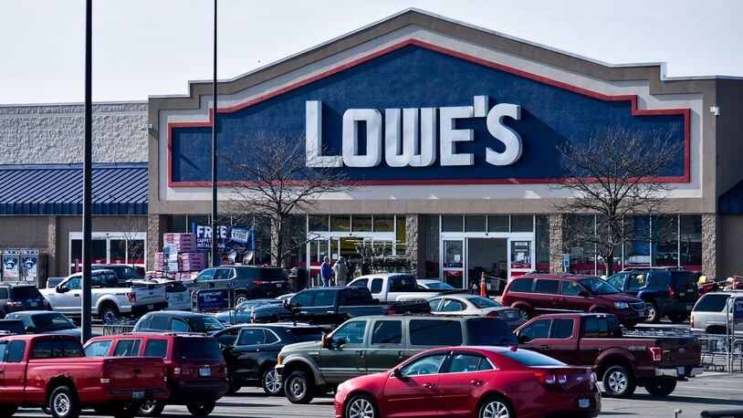 Lowe's in Middletown had a short line of people waiting to get in Monday, April 6. Stores are only allowing a limited number of people inside during the coronavirus pandemic. NICK GRAHAM / STAFF
