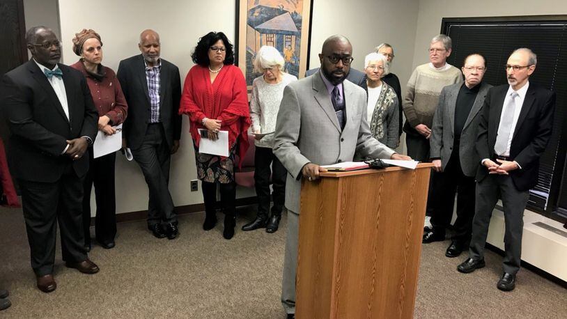 Rev. Rockney Carter of Zion Baptist Church shares details of the expanded civil rights complaint that he and other west Dayton clergy filed against Premier Health over the closing of Good Samaritan Hospital. KAITLIN SCHROEDER