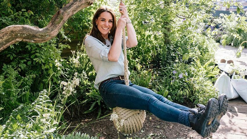 In this image made available on Sunday May 19, 2019 by Kensington Palace, Britain's Kate, Duchess of Cambridge and her son Prince Louis play in the ‘Bback to Nature’ garden at the RHS Chelsea Flower Show in London