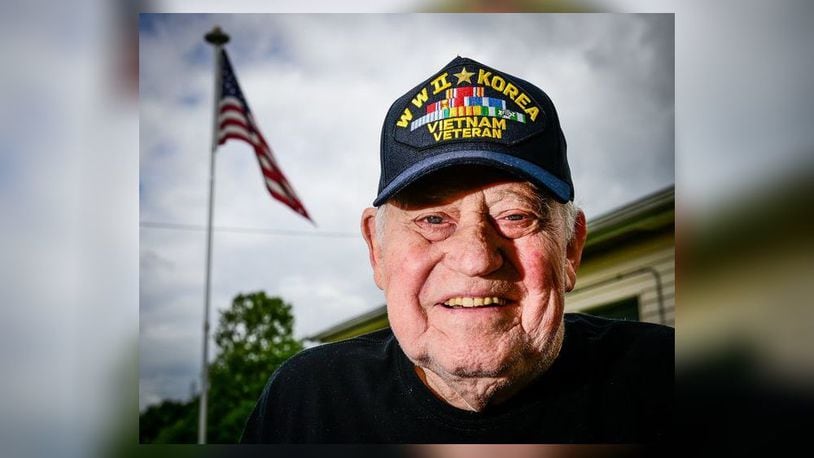Cecil Daily proudly wore a black baseball hat embroidered with “WWII, Korean, Vietnam Veteran” five years ago when he served as grand marshal of the Middletown Memorial Day Parade. Daily, 94, died Jan. 6. NICK GRAHAM/STAFF