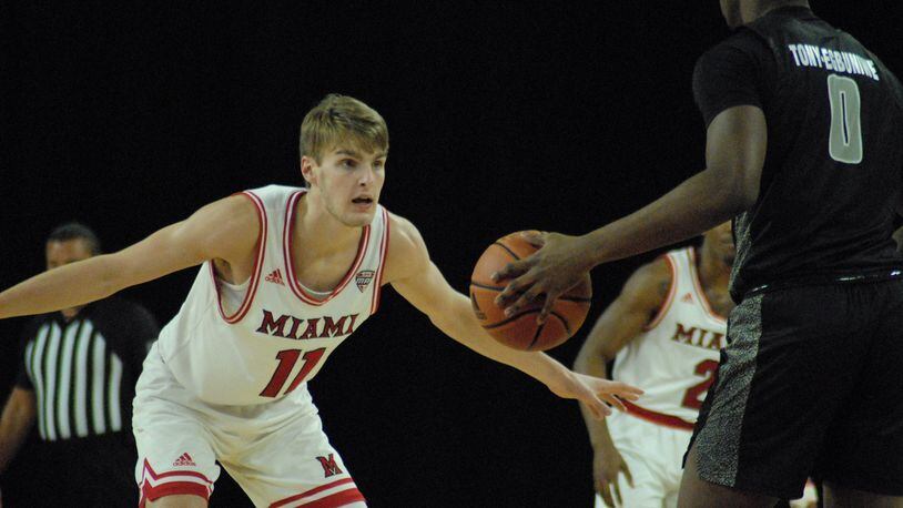 Miami's Billy Smith defends Daniel Egbuniwe of Arkansas Little Rock during Saturday's game at Millett Hall. Chris Vogt/CONTRIBUTED