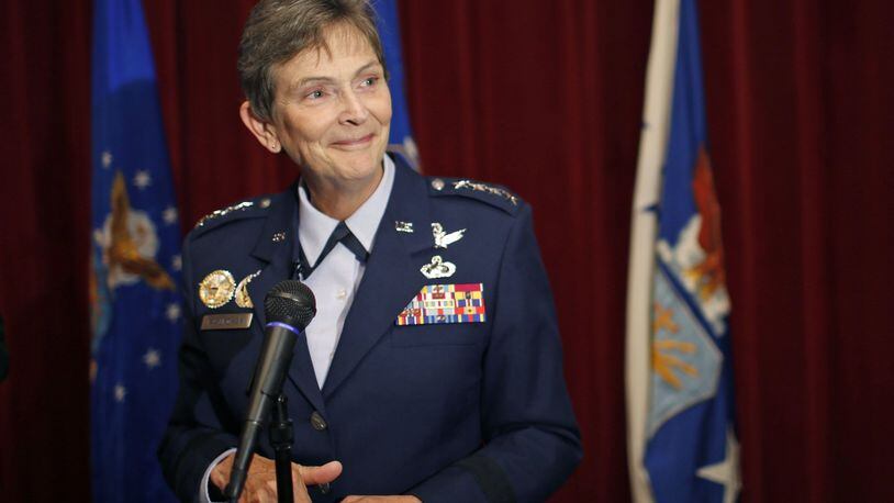 Gen. Ellen M. Pawlikowski was handed the Command Flag for the Air Force Materiel Command on Monday at Wright-Patterson Air Force Base during a ceremony where her predecessor, Gen. Janet Wolfenbarger also retired from the Air Force after a 35-year career. TY GREENLEES / STAFF