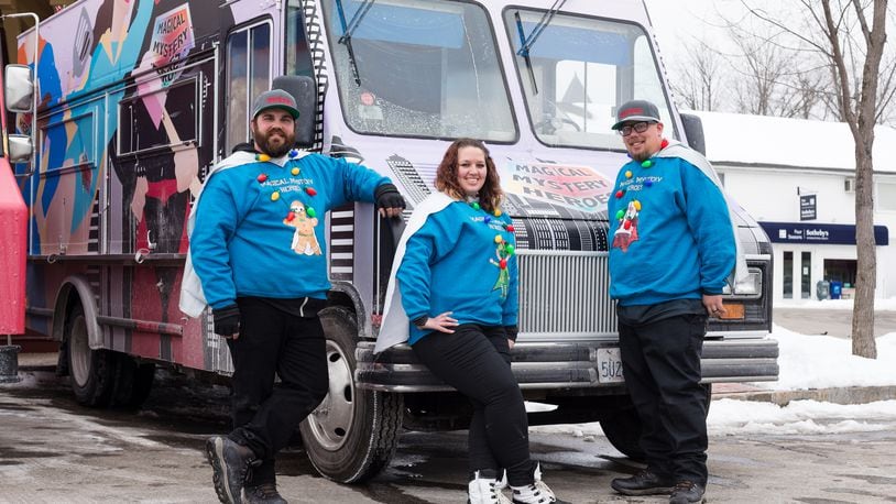 Magical Mystery Heroes, team members, Hannah Schulz, Matthew Williams, Chris Schulz, pose by their truck,  as seen on The Great Food Truck Race, Season 11.