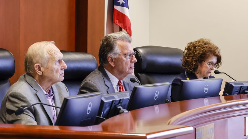 Butler County Commissioners Donald Dixon, left, T.C. Rogers, middle, and Cindy Carpenter listen to comments during a commission meeting Monday, Jan. 10, 2022 at the Butler County Government Services Center in Hamilton. NICK GRAHAM / STAFF