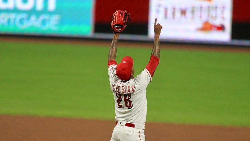 Reds reliever Raisel Iglesias celebrates a save against the Indians on Monday, Aug. 3, 2020, at Great American Ball Park in Cincinnati. David Jablonski/Staff