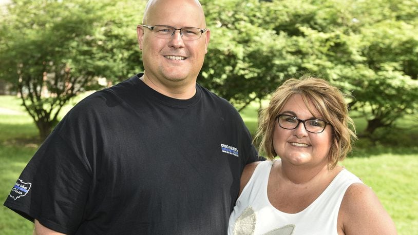 Retired Monroe Police Sgt. Eric Walton, pictured with his wife, Cathy, recently retired from the Monroe Police department. Along with his grandfather, father and uncle they have over 100 years of law enforcement service in Butler County. NICK GRAHAM/STAFF