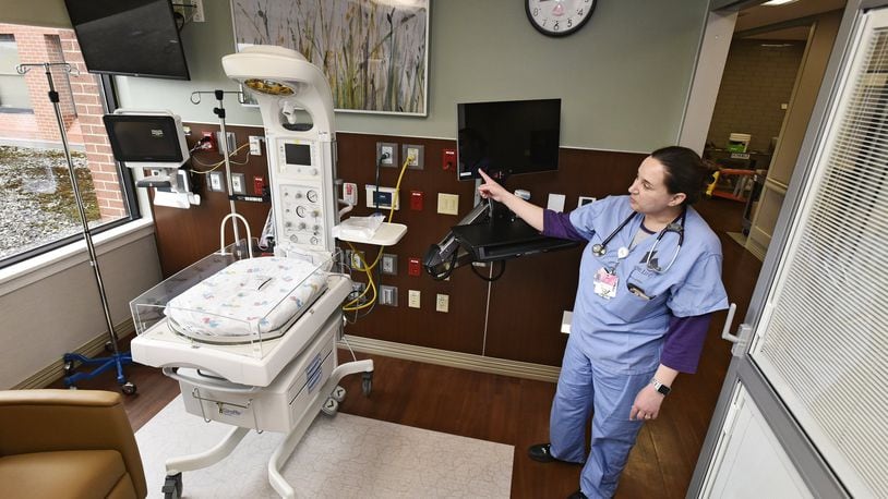 Jennifer Simmons, Clinical Coordinator/lactation consultant, shows off one of the new private rooms in the new special care nursery at Fort Hamilton Hospital Wednesday, March 20, 2019 in Hamilton. There are now eight private rooms for newborns and families instead of six babies in one room that the previous special care unit offered. NICK GRAHAM/STAFF