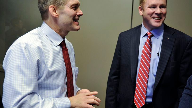 Congressman Warren Davidson, R-Troy, is supporting fellow Ohioan, Congressman Jim Jordan, R-Urbana, to be the next U.S. House speaker. Pictured is Jordan, left, on Jan. 21, 2016, at Homewood Suites in West Chester Twp. after he announced his endorsement of Davidson, right, in the race to replace former U.S. House Speaker John Boehner. NICK GRAHAM/FILE