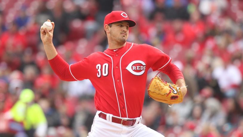 Reds starter Tyler Mahle pitches against the Cubs on Monday, April 2, 2018, at Great American Ball Park in Cincinnati. David Jablonski/Staff