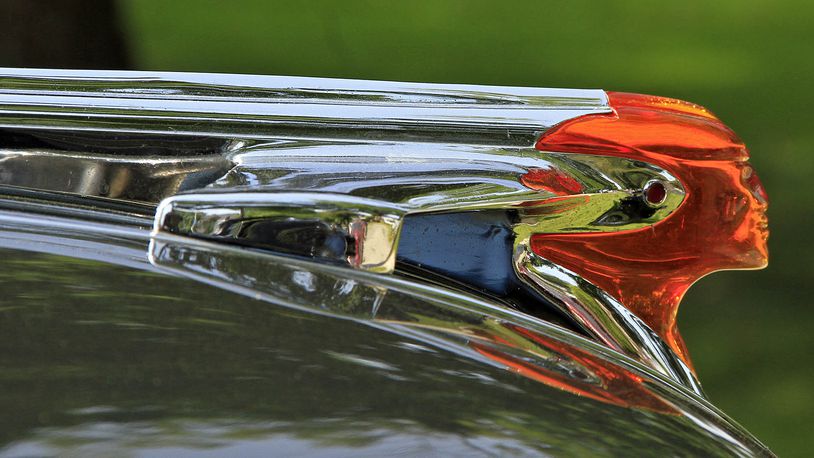 The hood ornament on a 1953 Pontiac at a Classics on the Lawn car show in Oakwood. © Photograph by Skip Peterson