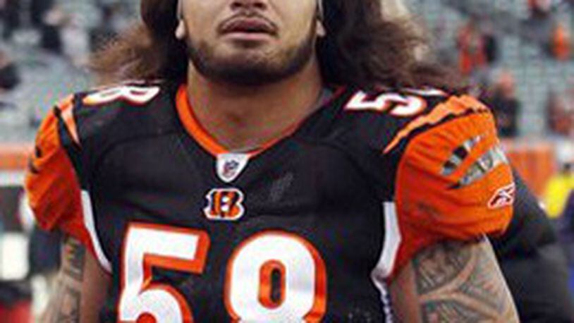 FILE - In this Sunday, Dec. 6, 2009 file photo, Cincinnati Bengals linebacker Rey Maualuga walks off the field after an NFL football game in Cincinnati. Police in northern Kentucky arrested Maualuga early Friday, Jan. 29, 2010 on charges of drunken and careless driving. (AP Photo/Tony Tribble, File)