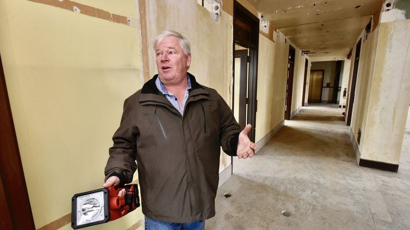 Developer Steve Coon walks through the Goetz Tower on the corner of Central Avenue and Main Street Friday, Oct. 26 in Middletown. After a water line break last winter, the Goetz Tower project is expected to get back on track to redevelop the office building into retail and apartment space. NICK GRAHAM/STAFF