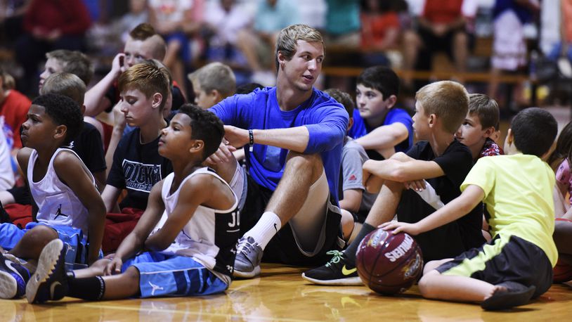 Luke Kennard sits with “Air Kev” team players during a celebration for the players and parents June 5, 2015, at Kingdom Sports Center in Franklin. Kennard, basketball trainer Kevin “Air Kev” Duncan, rapper and motivational speaker L.G. Wise and the Kingdom crew spoke to the young basketball players and their families promoting good decisions and work ethics. NICK GRAHAM/STAFF
