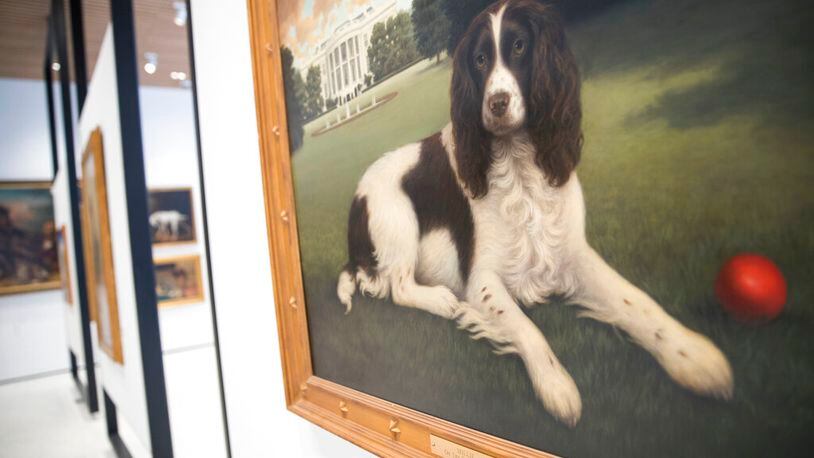 This Wednesday, Jan. 9, 2019, photo shows "Millie on the South Lawn" by Christine Merrill, on display at the American Kennel Club Museum of the Dog in New York. (AP Photo/Mary Altaffer)