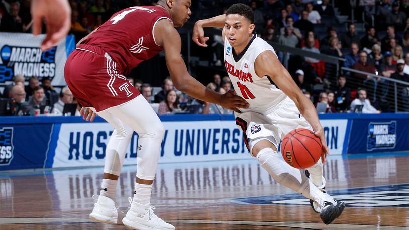 DAYTON, OHIO - MARCH 19: Kevin McClain #11 of the Belmont Bruins dribbles against J.P. Moorman II #4 of the Temple Owls during the first half in the First Four of the 2019 NCAA Men’s Basketball Tournament at UD Arena on March 19, 2019 in Dayton, Ohio. (Photo by Joe Robbins/Getty Images)
