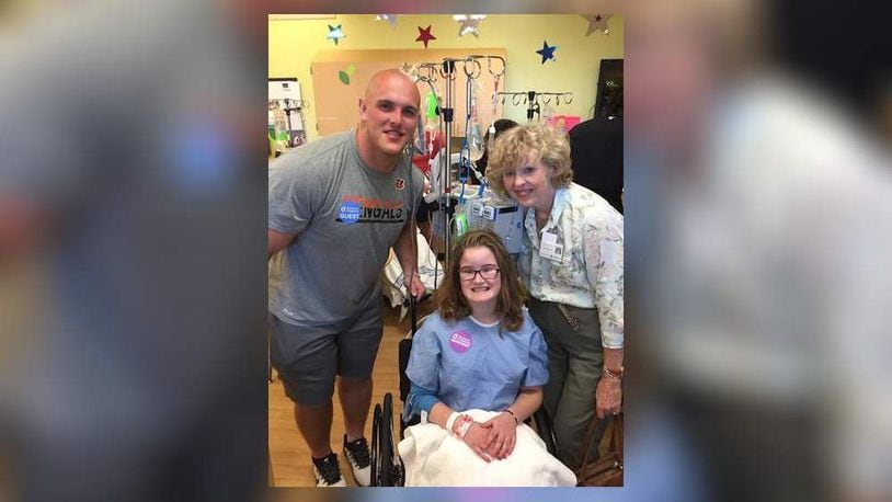 Cincinnati Bengals rookie center Billy Price visited Middletown resident Elley Ferrell and her grandmother, Laura Nell Ferrell, on Wednesday at Cincinnati Children’s Hospital Medical Center. CONTRIBUTED