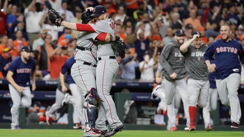 Boston relief pitcher Craig Kimbrel celebrates with catcher Christian Vazquez as the Red Sox took Game 5 of the American League Championship Series .