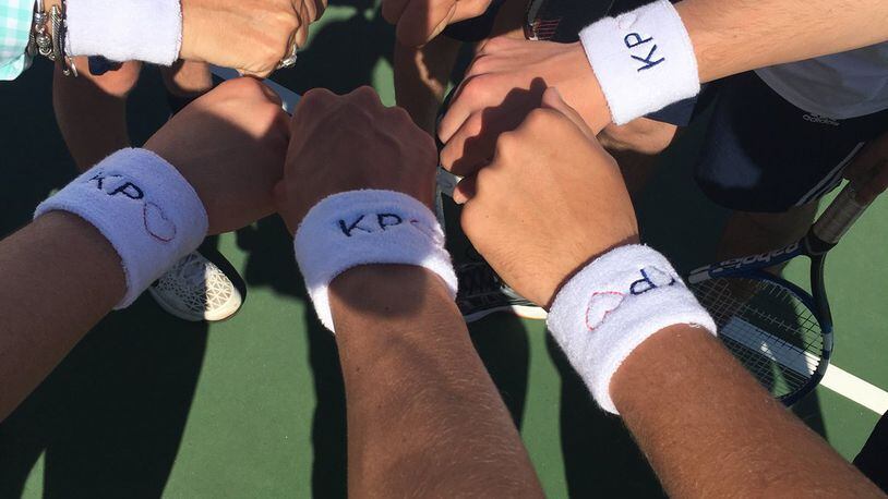 Members of the Oakwood High varsity boys tennis team honored Kyle Plush, the Cincinnati teen who died this month when he suffocated after being pinned by a seat in his minivan. The team wore wristbands that had Plush’s initials and a heart on them in a match Monday evening against Seven Hills the team for which Plush played. SUBMITTED