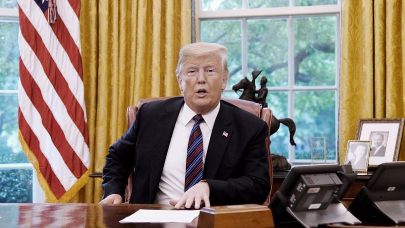 U.S. President Donald Trump talks to Mexican President Enrique Pena Nieto during a phone conversation on Monday, Aug. 27, 2018 to announce the United States-Mexico Trade Agreement in the Oval Office of the White House in Washington, D.C. (Olivier Douliery/Abaca Press/TNS)