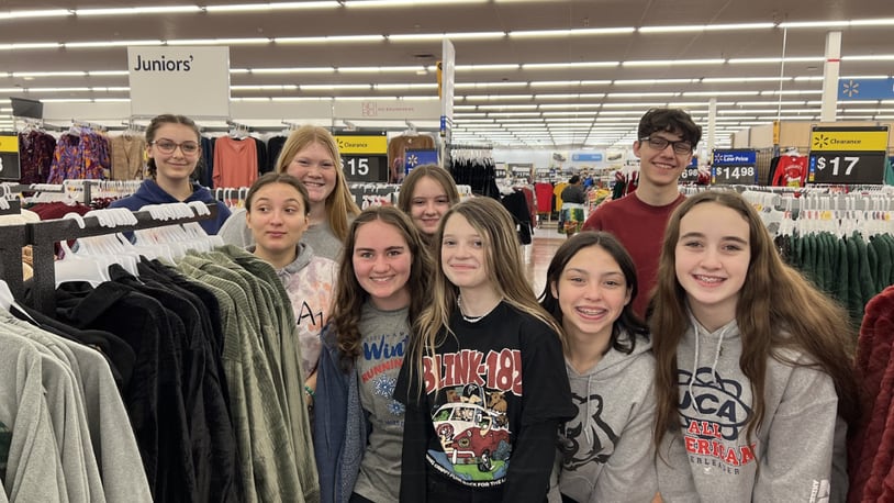High-achieving students at a Hamilton School got a recent, out-of-classroom lesson in charitable giving for the holidays. Pictured are some of the National Junior Honor Society (NJHS) students from Wilson Middle School who recently went Christmas shopping not for themselves but for needy classmates from low-income families children adopted by the school for the annual Holiday Angel Tree program. (Provided Photo\Journal-News)