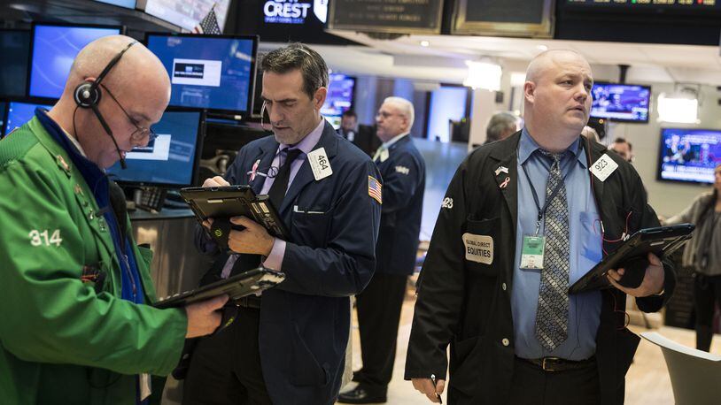 Traders on the floor of the New York Stock Exchange. (Photo by Drew Angerer/Getty Images)