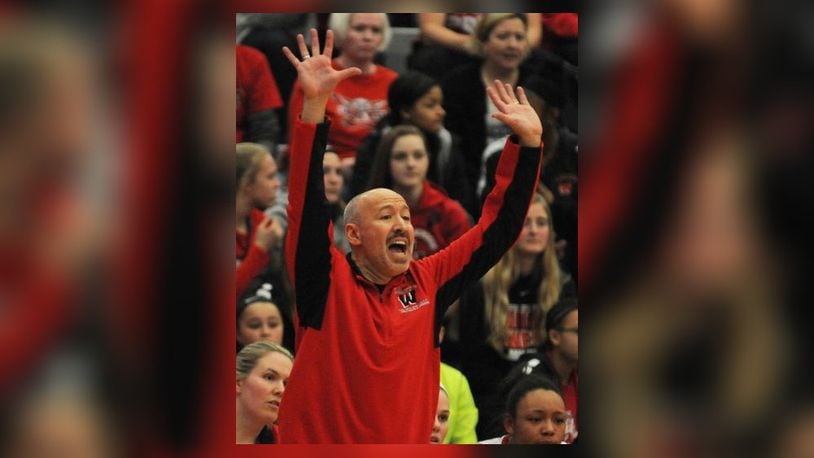 Lakota West Head Coach Andy Fishman shouts directions to his players during the closing minutes of the Firebirds 53-50 Div. I District Championship win over Beavercreek at Princeton High School on Saturday, March 4. David A. Moodie, contributng photographer