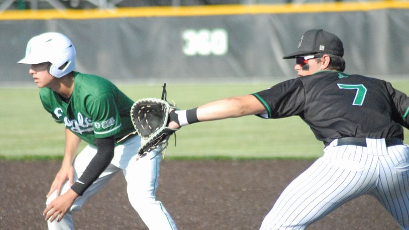 Badin first baseman Reese Anzalone holds on a Chaminade Julienne runner during Friday's Division II regional final at Mason. Chris Vogt/CONTRIBUTED